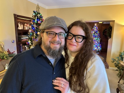 Couple in Annville Inn's parlor, just engaged showing ring.