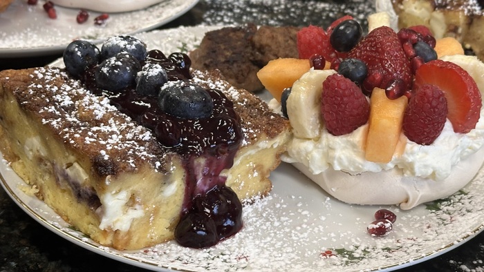 A delicious breakfast from Annville Inn, Bed and Breakfast. In this image, the table setting shows and the couple sitting at the table are all smiles!