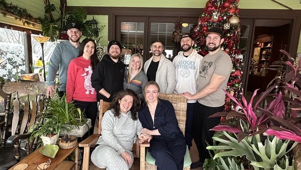 Group of 9 adults traveling together who booked out the entire Annville Inn. Photographed in front of the Inn's 12.5' tall Christmas Tree in the Garden Room.