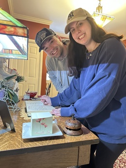 Newly wed couple checking in at Annville Inn's main lobby.