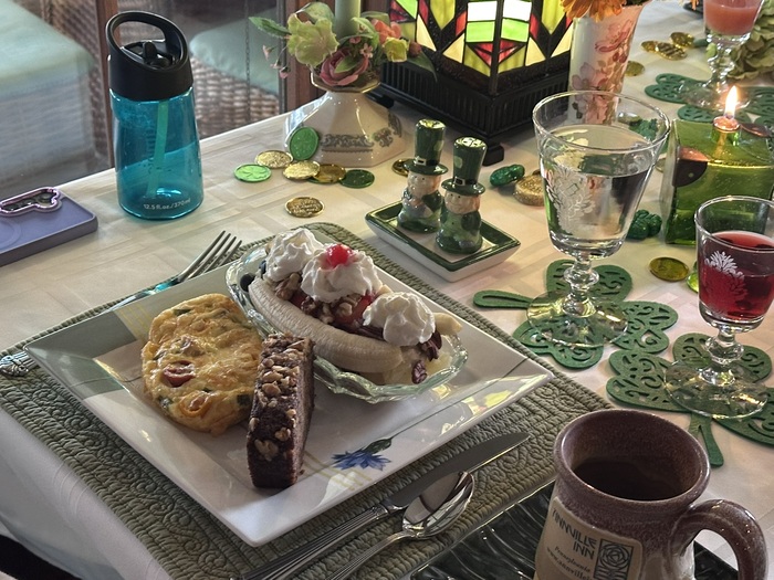 A delicious breakfast from Annville Inn, Bed and Breakfast.
Formal table setting is a playful theme of St. Patrick's day with leprechon salt and pepper shakers, all linens in shades of green, and 
