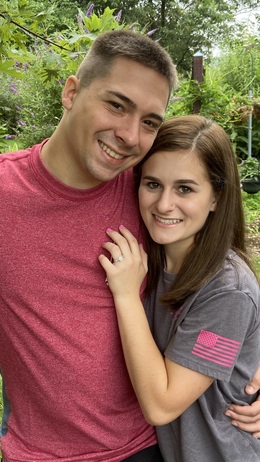 Newly engaged couple at Annville Inn in one of the Gardens, showing off their engagement ring.