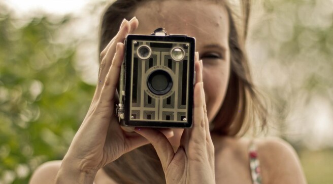 Girl with box brownie camera