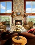 Mountain Goat Lodge's river rock fireplace provides country warmth