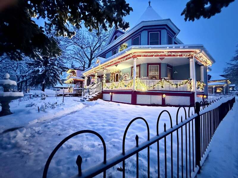 Holden House holiday lights in the snow