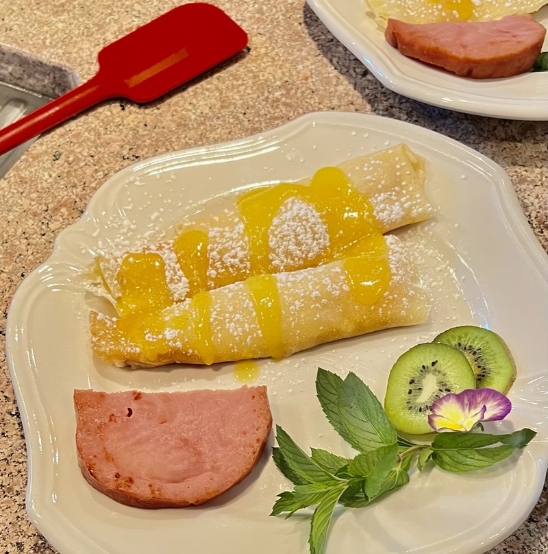 Holden House prides itself on signature dishes like this peaches and cream crepes
