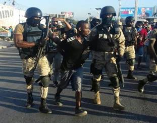 https://i2.wp.com/sfbayview.com/wp-content/uploads/2016/12/Haiti-election-protest-masked-police-arrest-protester-1216-by-HIP-web.jpg?resize=400%2C357